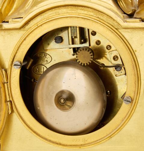 A French mantel clock. Louis XVI style, first half of the 20th