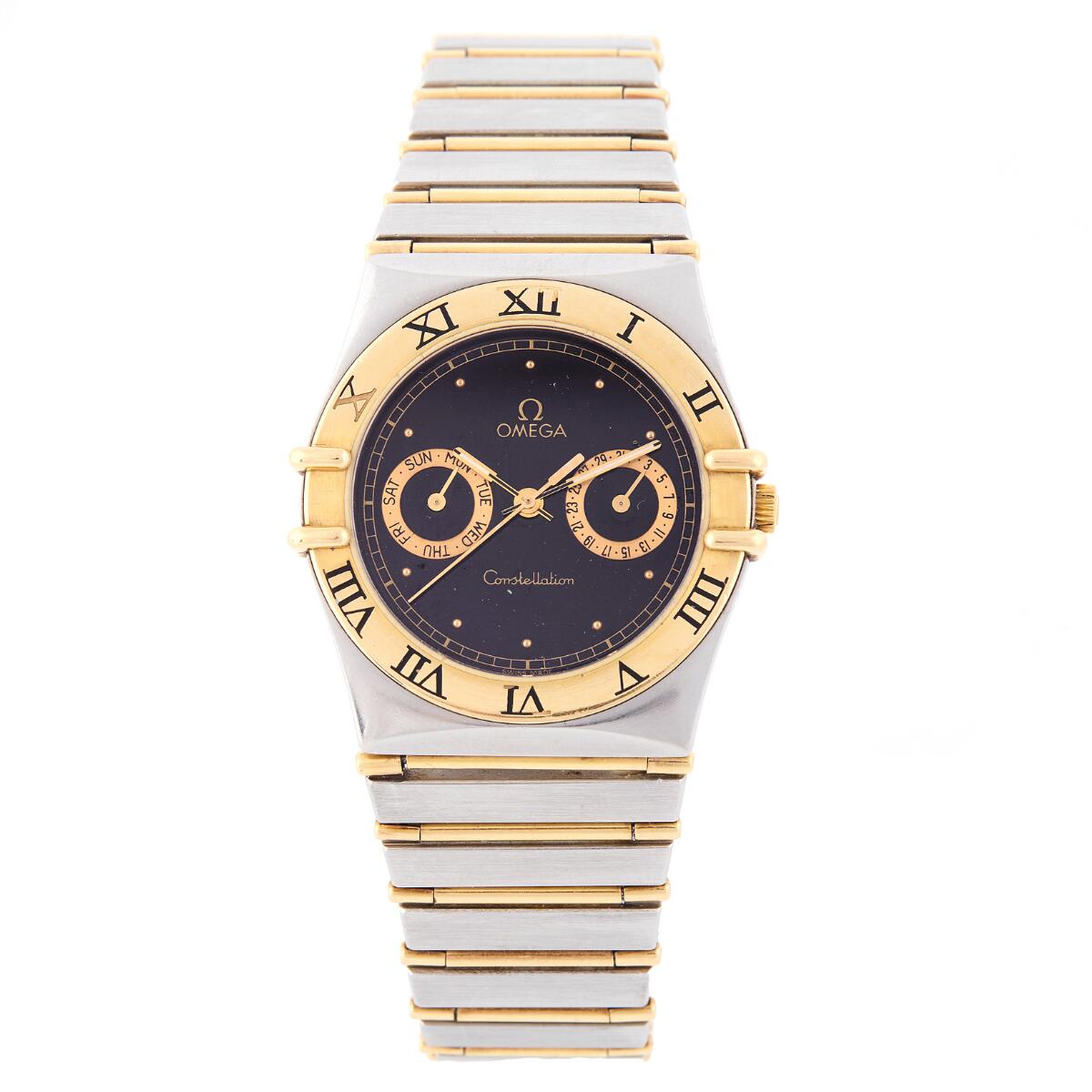 Constellation Date of 18k gold and steel, ref. 345.1070. Quartz movement with automatic winding, date indication and day indication, cal. 1445. Omega bracelet of 18k gold and steel with fold-over clasp. Circumference approximately 18 cm. Ø 32 mm. 1980s.