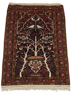Turkmensk tæppe, prydet med havemotiv på blå bund. 20. årh.s slutning. 170 x 126.
