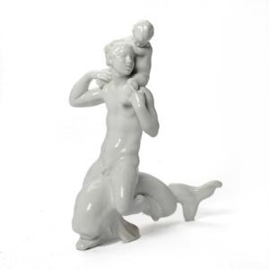 Kai Nielsen Figurgruppe af blanc de chine. Modelleret i form af mand og dreng ridende på delfin. H. 42,5.