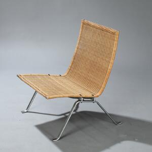 Poul Kjærholm PK-22. Hvilestol med stel af matforkromet stål, sæde og ryg med peddigrørsflet. Udført og stemplet hos E. Kold Christensen.