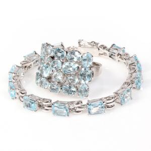 Topassmykkesæt bestående af ring og armbånd, begge prydet med talrige facetslebne topaser. Str. 54,5. L. ca. 19,9 cm. 2012. 2