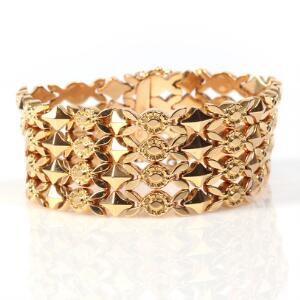 Bredt italiensk armbånd af 18 kt. guld. L. ca. 18 cm. Vægt 54. gr.