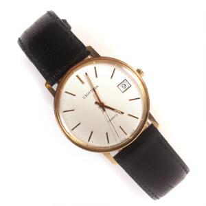 Certina Herrearmbåndsur af 18 kt. guld. Quartz med dato. Ca. 1985.