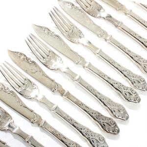 Tang. Fiskebestik af sølv, bestående af ti knive og ti gafler. Stemplet Cohr. 20. årh. Vægt ca. 780 gr. 20