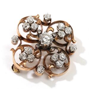 Diamantbroche af guld og hvidguld, prydet med talrige brillant- og rosenslebne diamanter på i alt ca. 1,80 ct. Diam. 3. 19. årh.s slutning.