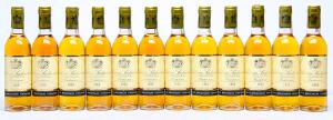 12 bts. ½. Château Suduiraut, Sauternes. 1. Cru Classé 1986 A-AB bn.