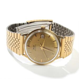 Kasta Herrearmbåndsur af 14 kt. guld. Automatisk værk med dato. Forgyldt lænke. Kassediam. 36 mm.