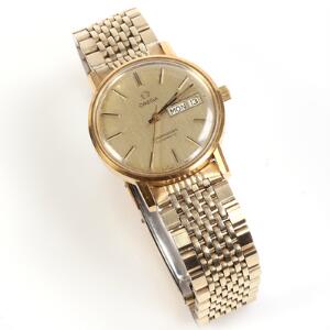 Omega Herrearmbåndsur af guldbelagt stål. Model Seamaster. Automatisk værk med dag og dato. 1970erne.