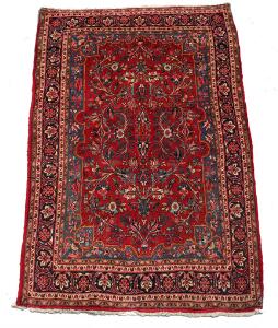 Bidjar tæppe prydet med blomster og bladværk på rød bund. Persien. 20 årh. 209 x 135.