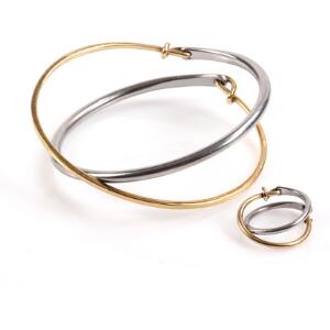 Ole Bent Petersen Smykkesæt af 18 kt. guld og stål bestående af en armring og ring. Diam. 6 cm. Str. 53. 2