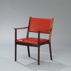 Ole Wanscher Armstol med stel af palisander. Sæde samt ryg betrukket med rødt farvet skind. Model PJ412. Udført hos P. Jeppesen.
