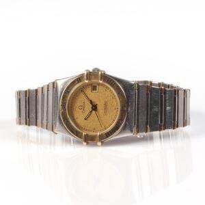 Omega Damearmbåndsur af guld og stål. Model Constellation. Quartz med dato. 1990erne.