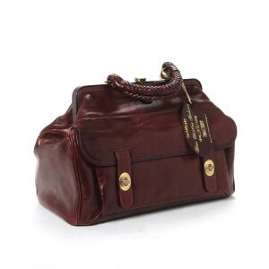 H.C. Andersen rejsetaske af brunt læder med flettet hank og en indvendig og en udvendig lomme og messingbeslag. Fremstår ubrugt. L. ca. 36 x 26 cm.