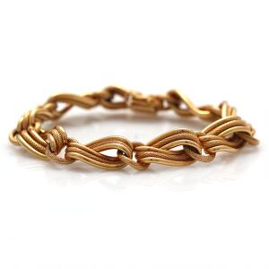 Armbånd af 18 kt. guld. L. ca. 22 cm. Vægt. 26,5 g.