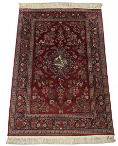 Keshan medaljontæppe med silke, prydet med blomster og bladværk på rød bund. Persien. 20. årh.s anden halvdel. 213 x 140.