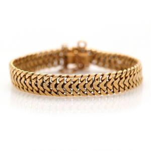 Armbånd af 18 kt. guld. L. 19,5 cm. Vægt 42 gr.