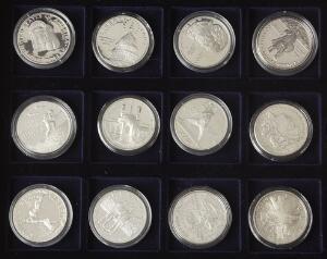 USA, æske fra Mønthuset Danmark med 12 og 1 Dollar sølvmønter, i alt 25 stk. i varierende kvalitet med enkelte bedre mønter iblandt