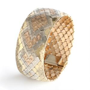 Armbånd af 14 kt. trefarvet guld. Vægt 66 gr. L. 19,5. B. 3,7.
