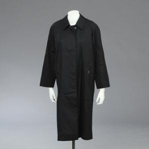 Burberry Lang sort cotton coat med ternet for. L. ca. 104 cm. Ca. str. 40. Fremstår ubrugt med mærker. Nypris kr. 6.299,00.