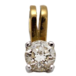 Diamantvedhæng af 18 kt. guld- og hvidguld prydet med brillantslebet diamant. L. ca. 0,9 cm. Ca. 1990.