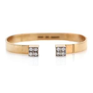 Reeslev Diamantarmring af 14 kt. guld prydet med talrige brillantslebne diamanter. Diam. ca. 5,5 cm. Vægt 22 gr.
