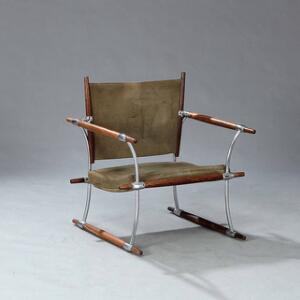 Jens H. Quistgaard Stokkestol. Hvilestol med stel af palisander og forkromet stål. Sæde, ryg samt løs hynde betrukket med grønt ruskind.