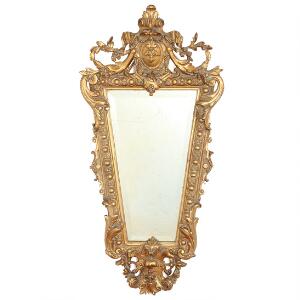 Spejl i ramme af forgyldt og udskåret træ og gesso, prydet med blomster og bladværk. Ca. 1880. H. 100. B. 49.