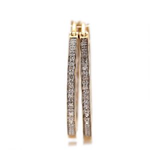 Et par diamantørestikker af 14 kt. guld creolmodel prydet med talrige brillantslebne diamanter. Diam. ca. 2 cm. 2