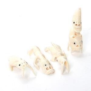 Fire Grønlandske tupilakker af udskåret kaskelot tand. 20. årh. H. 9-11 cm. 4