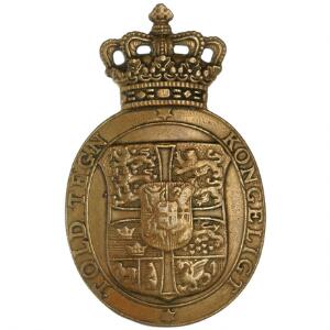 Kongeligt Told Tegn fra A. Michelsen i ovalt messing med krone på toppen med nr. 00223 indslået på revers, 65 x 40 mm