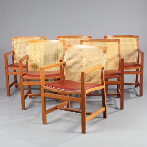 Rud Thygesen, Johnny Sørensen Kongeserien. Seks armstole af mahogni med fransk rørflet ryg, sæder med rødt skind. Udført hos Botium. 6