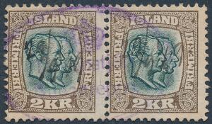 1907. Dobbelthoveder. 2 kr. brungrøn. Dekorativt par med ovalt violet stempel samt BLÆK-annullering. Sjældent.