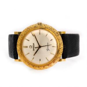 Omega Herrearmbåndsur af 18 kt. guld. Model Geneve. Mekanisk værk med manuelt optræk. 1960erne.