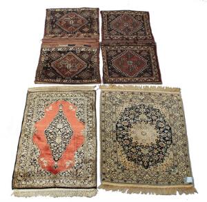 Fire persiske tæpper. Nain og Qum forliggere samt to dobbelte lurikhasgai sadeltasker.4