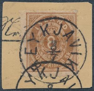 1873. 8 skilling, brun. Ægte stemplet mærke på lille brevklip, annulleret REYKJAVIK 3.7. Påsat hjørnetak i nø-hjørne. Facit 10000