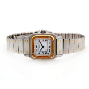Cartier Damearmbåndsur af guld og stål. Model Santos. Automatisk værk. 1990erne.