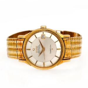 Omega Herrearmbåndsur af 14kt. guld. Model Constellation. Chronometer certificeret automatisk værk med dato. 1960erne.
