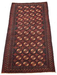 Belouch tæppe, prydet med gentagelsesmønster i form af güls på mørk bund. Perien. 20. årh. 276 x 147.