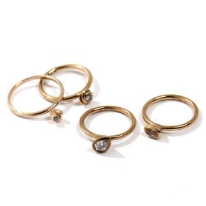 Spinning Jewellery. Fire ringe af 8 kt. guld, prydet med facteslebne smykkesten. Vægt 5,2 gr. Str. 50,5-56,5. 4