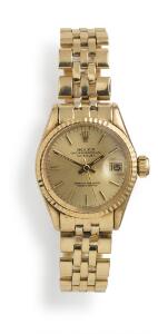 Rolex Damearmbåndsur af 18 kt. guld. Model Oysterperpetual DateJust, ref. 6521. Chronometer certificeret automatisk værk med dato. 1960-70.
