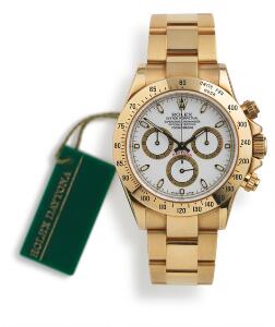 Rolex Herrearmbåndsur af 18 kt. guld. Model Oyster Perpetual Daytona, ref. 116528. Chronometer certificeret automatisk værk med kronograf. 2003.