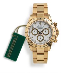 Rolex Herrearmbåndsur af 18 kt. guld. Model Oyster Perpetual Daytona, ref. 116528. Chronometer certificeret automatisk værk med kronograf. 2003.