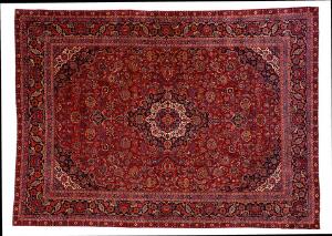 Keshan tæppe, Persien. Klassisk medaljondesign på rød bund prydet med slyngede grene, blomster og bladværk. 20. årh.s midte. 430 x 313.