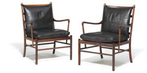 Ole Wanscher Colonial. Et par armstole af palisander, sæder med sjeneflet. Løse hynder i sæde og ryg betrukket med sort skind. 2
