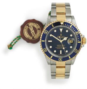 Rolex Herrearmbåndsur af guld og stål. Model Submariner, ref. 16613. Chronometer certificeret automatisk værk med dato. 2000.