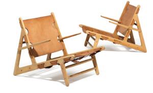 Børge Mogensen Jagtstolen. Et par hvilestole af ask. Sæde og ryg udspændt med patineret kernelæder. Udført hos Fredericia Stolefabrik. 2