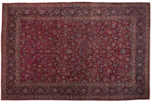 Mashad tæppe, Persien. Gentagelsesmønster med rosetter, palmetter og blomster på rød bund. 20. årh.s midte. 523 x 336.