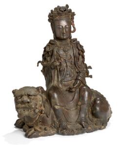Ming Guanyin siddende på fabeldyr af patineret bronze. Kina 1368-1644. H. 28 cm.