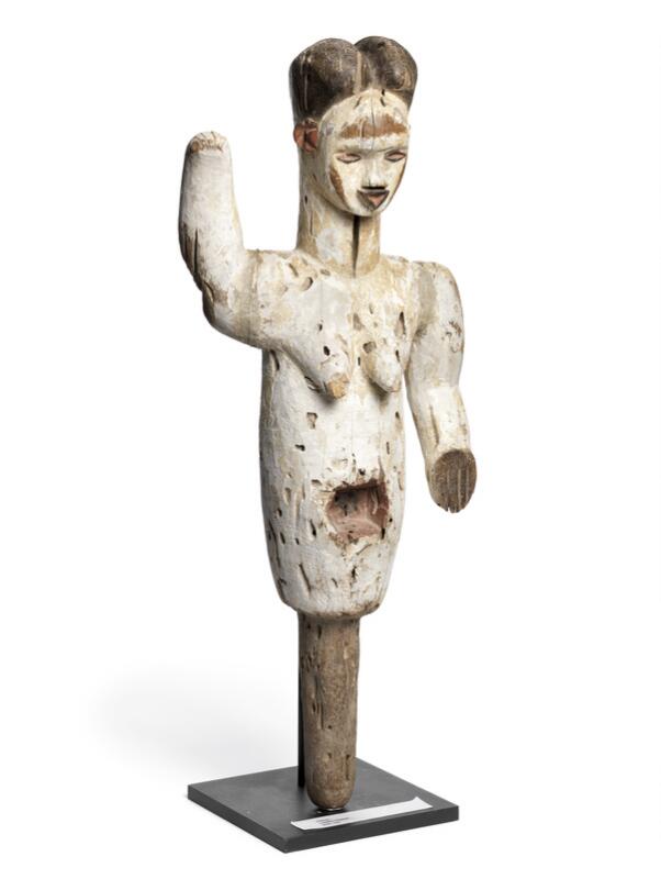 Female figure of carved patinated wood decorated with black, red and white...